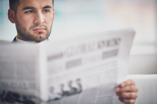 Man Reading the News