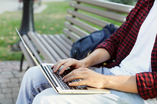 Man typing on keyboard